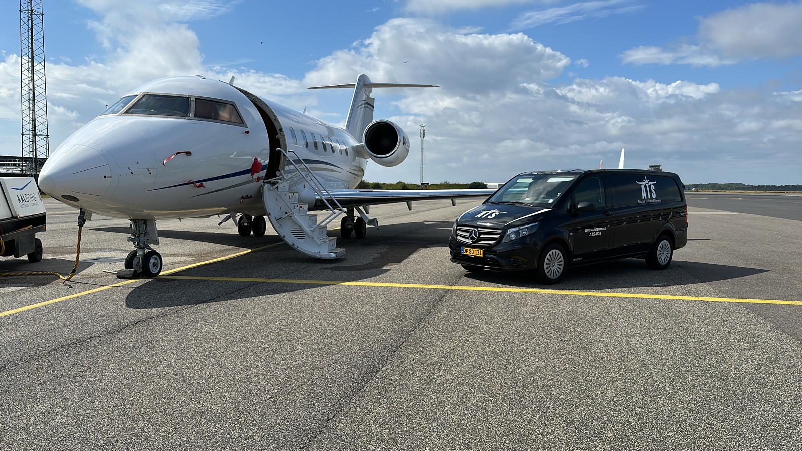 Bombardier Challenger business jet with ATS van at Aalborg