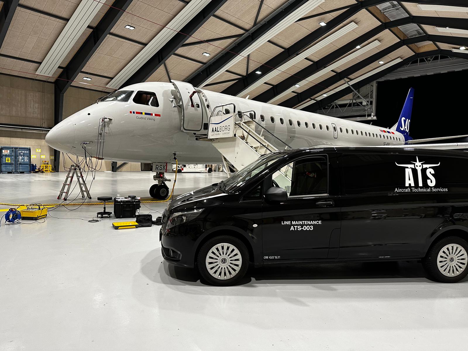 SAS Embraer in the Aalborg hangar overnight with ATS van